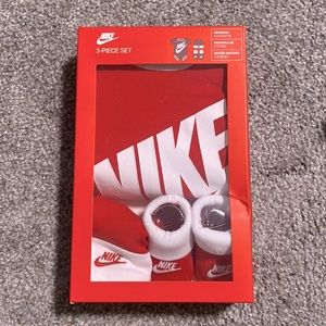 Newborn Nike 3-piece set red includes socks Nike logo, hat, and onesie
